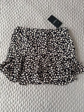 Saint Laurent Black Mini Skirt with White Star Print and Ruffle Hem